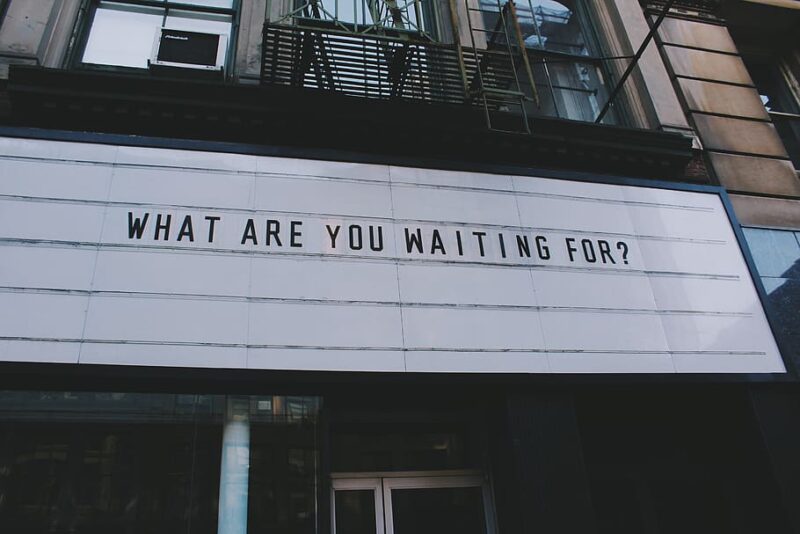 Billboard that reads: "What are you waiting for?"
